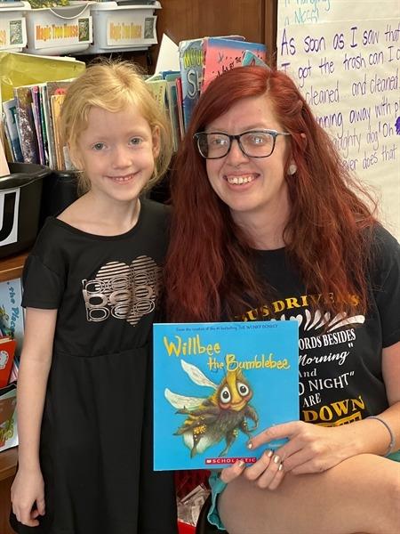 Bus driver Kim Taylor reads to students at BES.